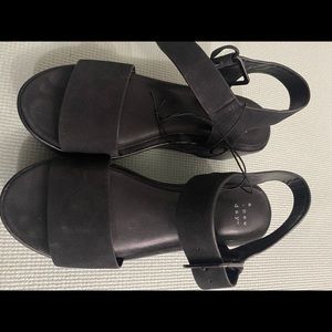 Black flat form sandals